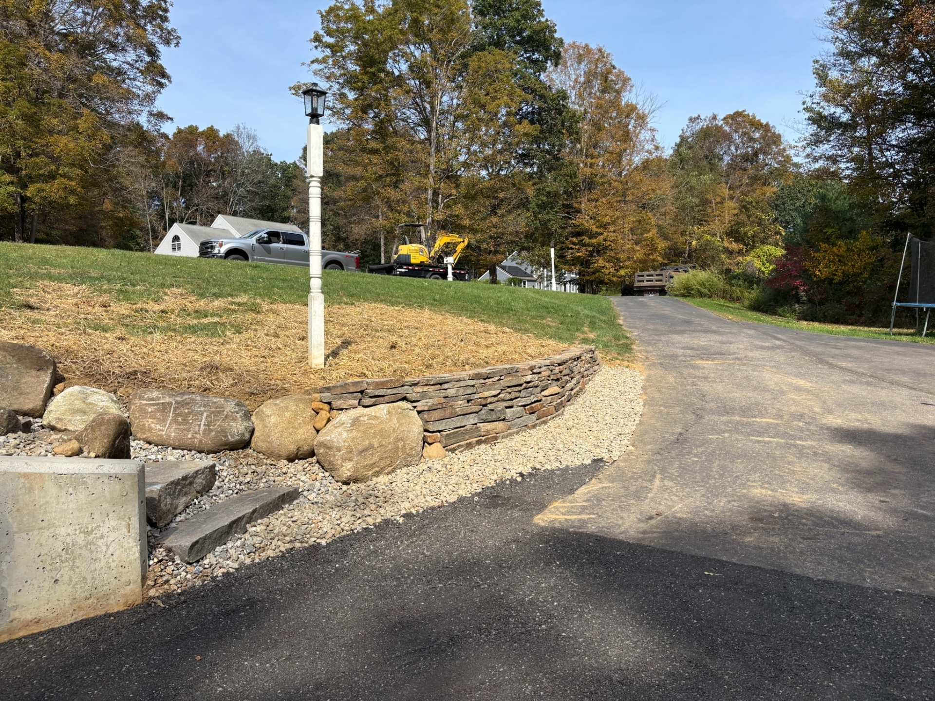 Stone retaining wall and landscaping